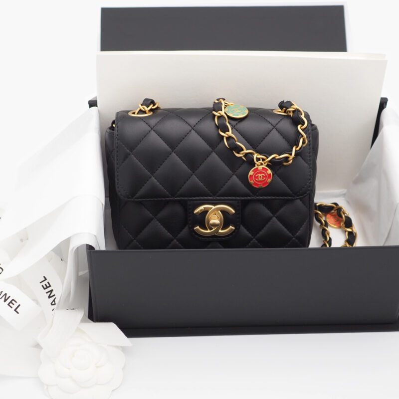 Chanel Black Lambskin Mini Flap Bag with Enamel Charms & Gold-Tone Metal Hardware (NT7TEE4)