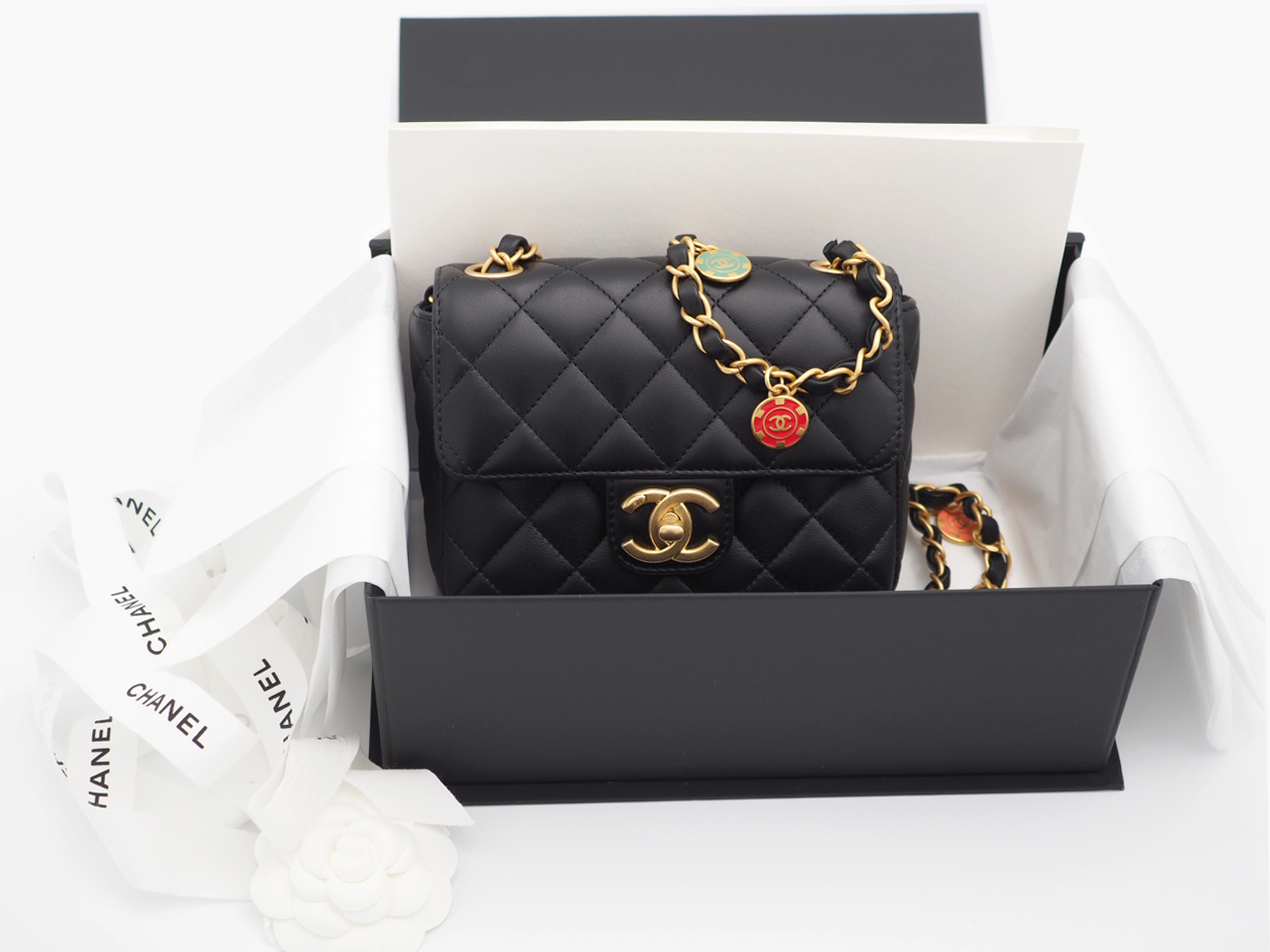 Chanel Black Lambskin Mini Flap Bag with Enamel Charms & Gold-Tone Metal Hardware (NT7TEE4)